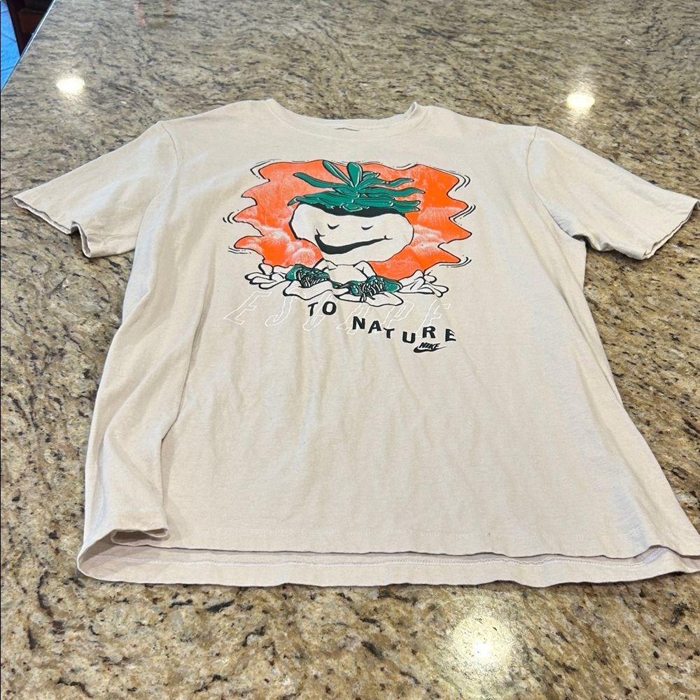 Nike Cream Graphic Tee with Orange and Green Nature Print